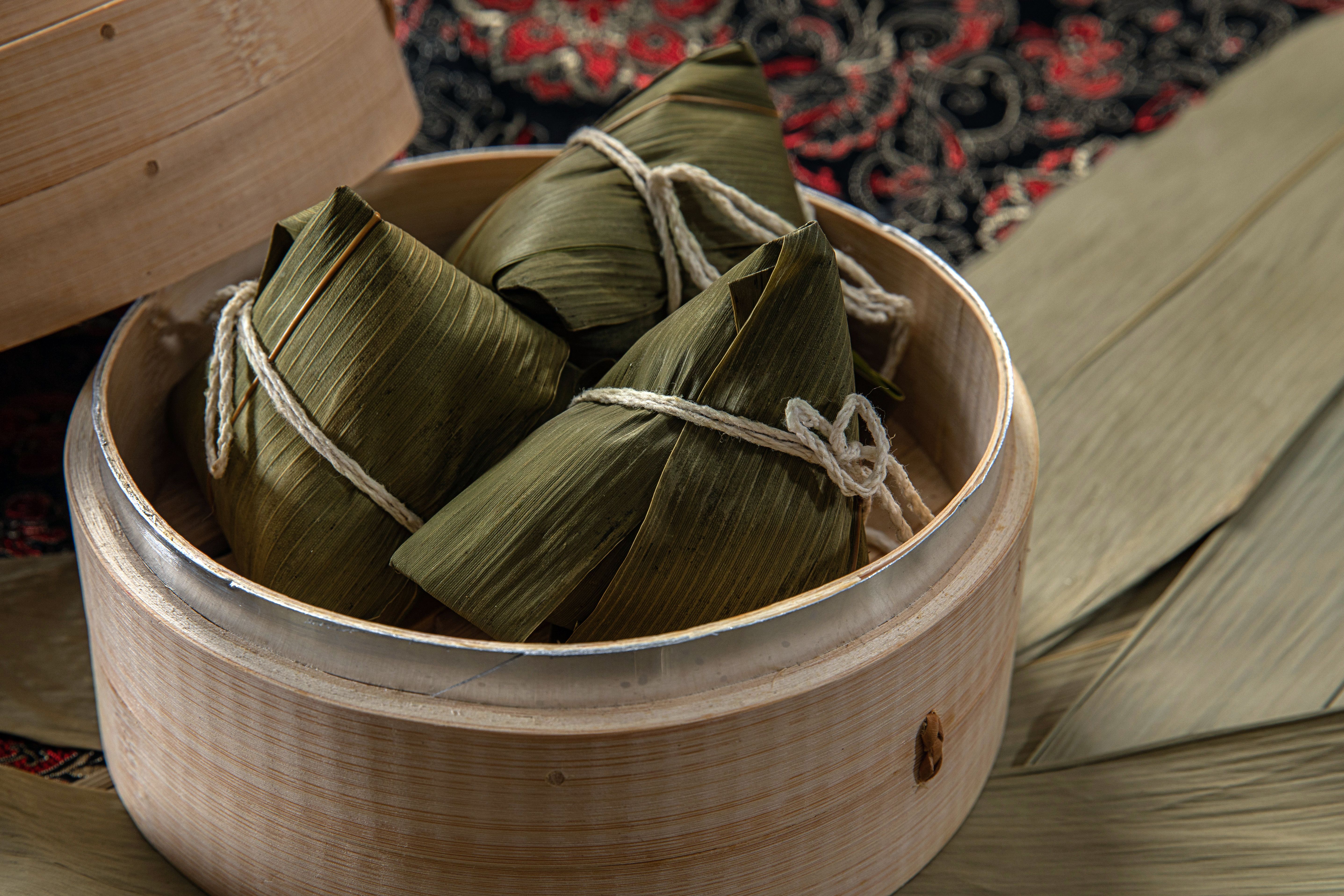 Delicious Taiwanese zongzi in a bamboo steamer, showcasing traditional Asian cuisine.